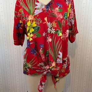 Baggy floral tropical short sleeved tye in front shirt. Fits like a large.